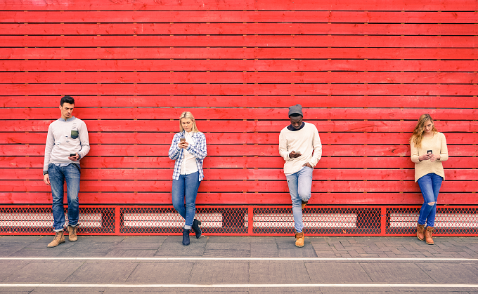 iStock-515792720_people on devices with red wall_resized.png