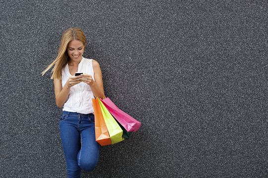 iStock_75115445_LARGE_girl_with_shopping_bags_resized.png